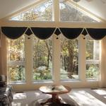 Carol Schenck, of Boonville, wanted a treatment that wouldn't hide her lovely view of the woods.  When she needs privacy or light control she simply pulls pleated gauze panels together.