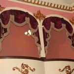 The box seats in historic Thespian Hall, oldest theatre west of the Alleghnies, in Boonville, Missouri.  These lush velvet swags and cascades are trimmed in six inch gold bullion fringe and lined in gold moire.