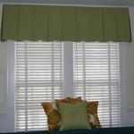 Happy pillows and a classic inverted pleat valance give this traditional home a great update!