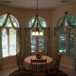 Charles and Jo Burks have a beautiful dining area that looks out onto the woods.  They wanted to finish off the room and enhance the view with window treatments.  Jo chose a gorgeous floral botanical fabric with birds.