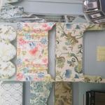 Here are a few of the samples we have in our shop of valances that can be used alone, or over the top of drapery panels.